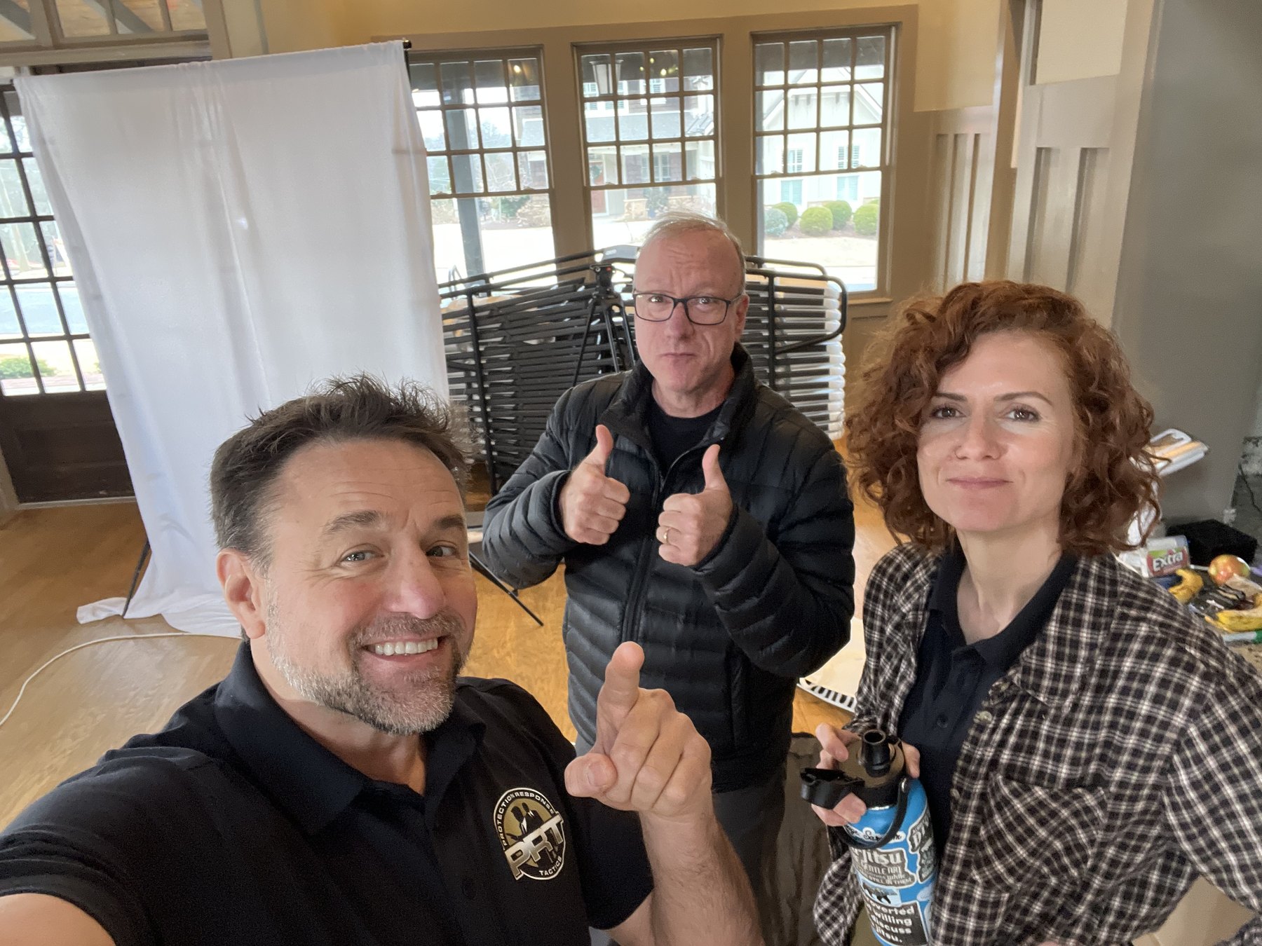 Alan Baker, Coach Bob Burgee, and a member of the Academy team working together behind the scenes