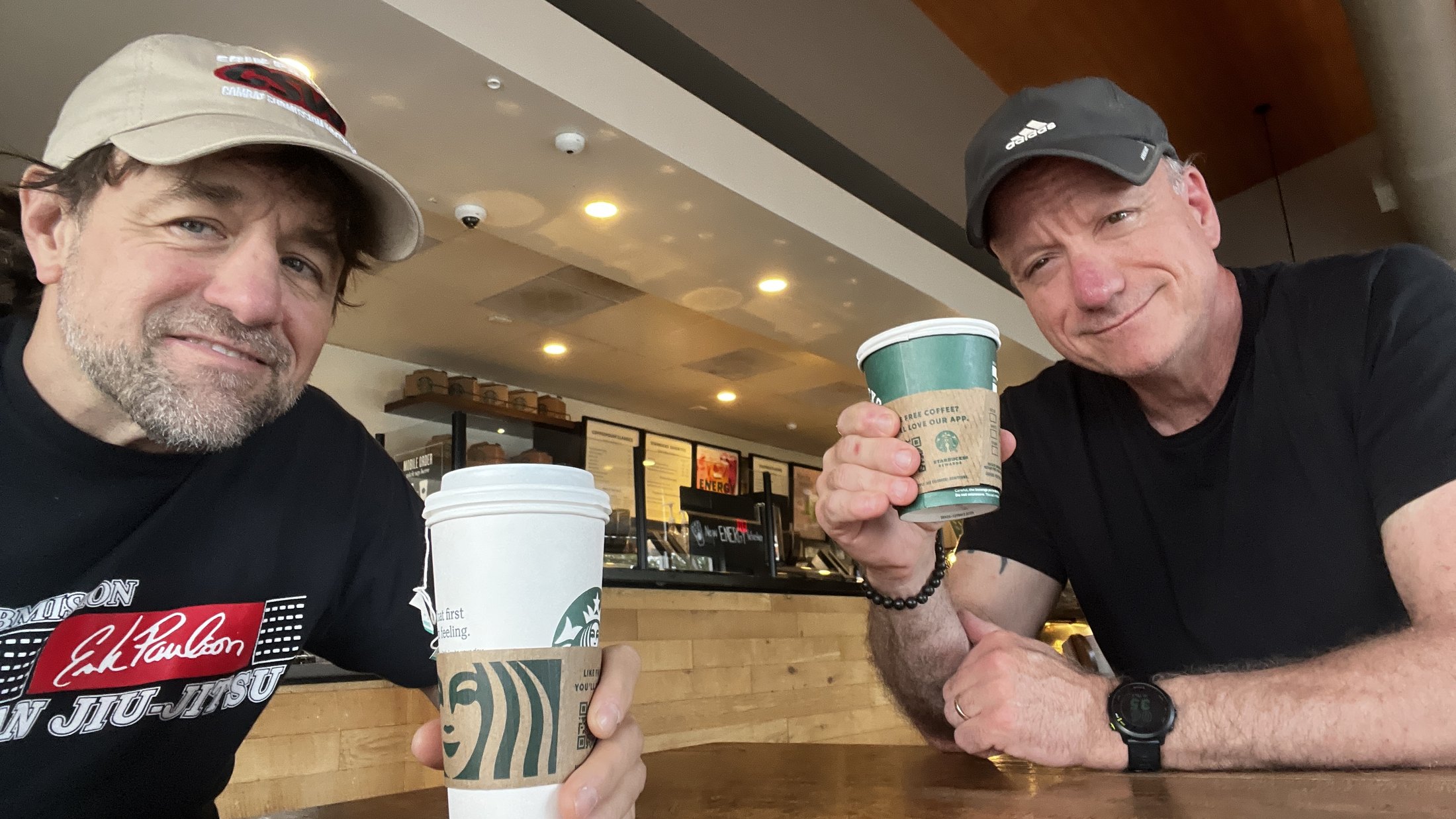 Alan Baker and Coach Bob Burgee sharing coffee during an Academy conversation